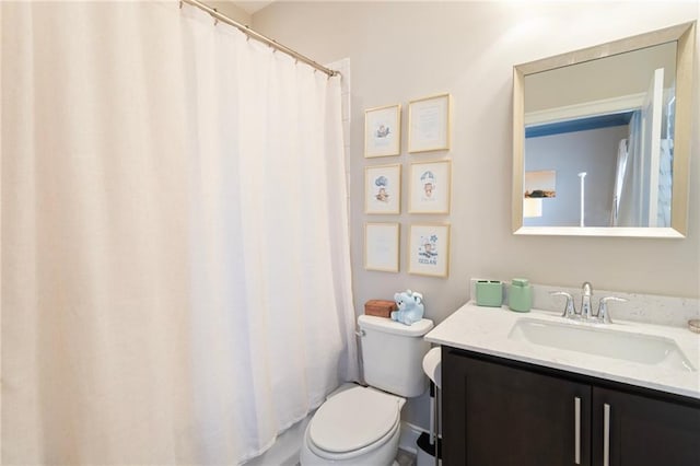 full bathroom with vanity and toilet