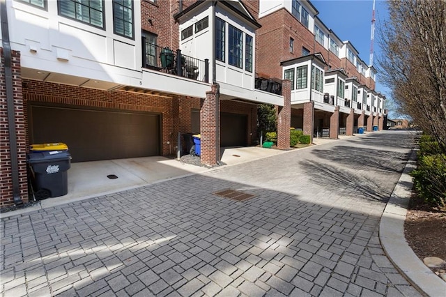 exterior space with driveway and an attached garage