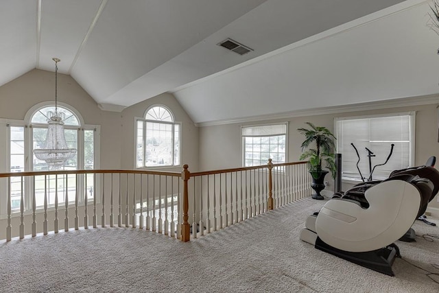 living area featuring carpet floors, lofted ceiling, and visible vents