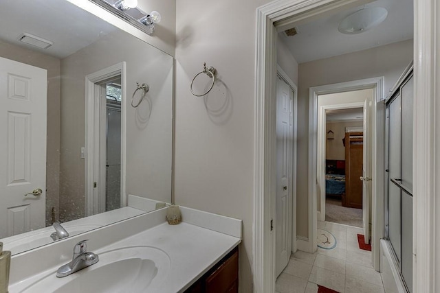 bathroom featuring visible vents, tile patterned flooring, and vanity