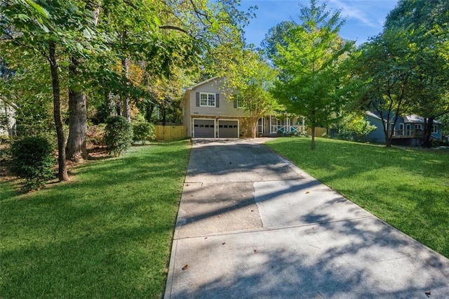 view of front facade featuring a front yard and a garage