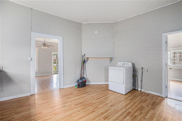 clothes washing area featuring light wood-type flooring, washer / dryer, and ceiling fan