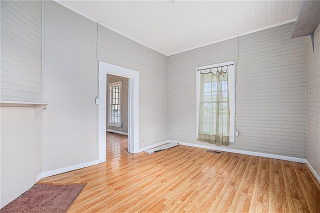 spare room with wood-type flooring