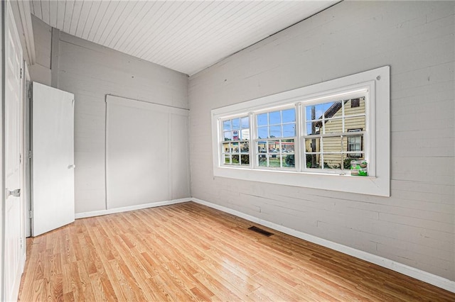 unfurnished bedroom with a closet and wood-type flooring