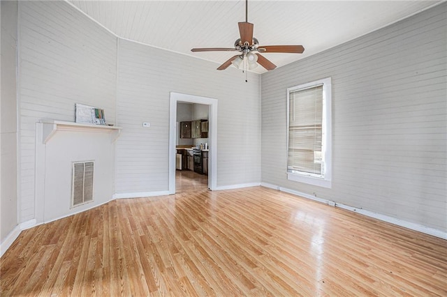 unfurnished living room featuring ceiling fan and light hardwood / wood-style floors