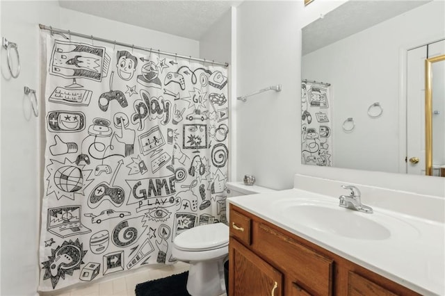 bathroom with toilet, tile patterned floors, curtained shower, a textured ceiling, and vanity