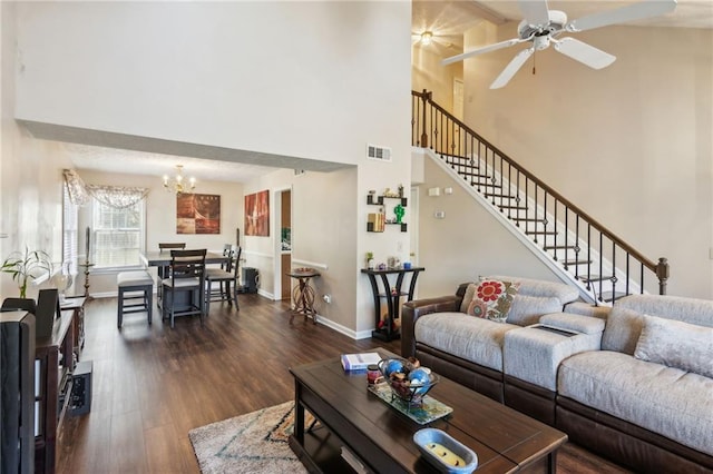 living room with visible vents, dark wood finished floors, stairway, and baseboards