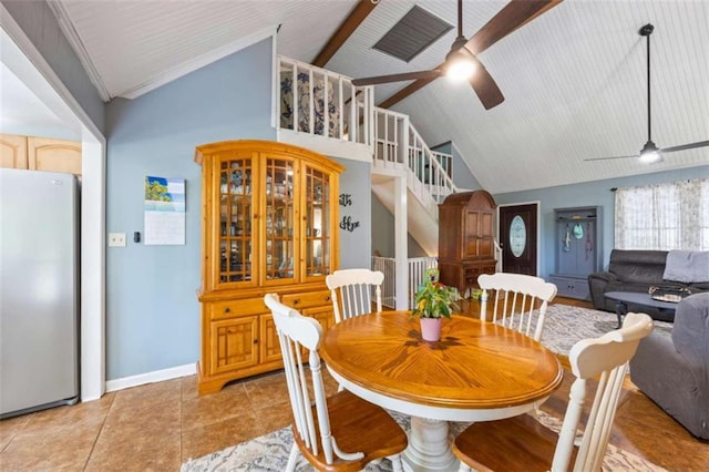 dining area with beamed ceiling, high vaulted ceiling, ceiling fan, and light tile patterned flooring