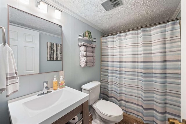 bathroom featuring ornamental molding, vanity, toilet, a textured ceiling, and a shower with curtain