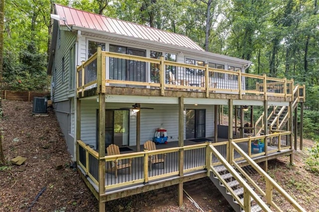 rear view of property with a deck, ceiling fan, and central air condition unit