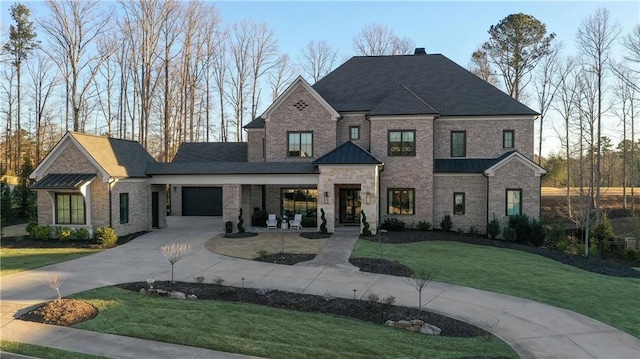 view of front of house with concrete driveway, brick siding, and a front lawn