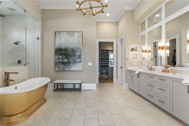 bathroom featuring a freestanding tub, vanity, baseboards, marble finish floor, and a shower stall