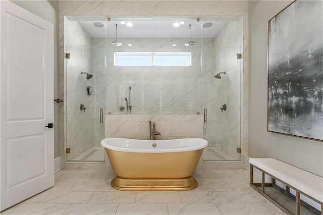 full bath featuring marble finish floor, a marble finish shower, and a freestanding bath