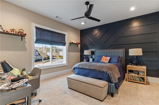 carpeted bedroom with recessed lighting, visible vents, an accent wall, ceiling fan, and baseboards