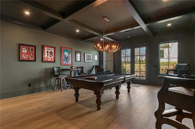 game room featuring billiards, coffered ceiling, wood finished floors, a chandelier, and beam ceiling