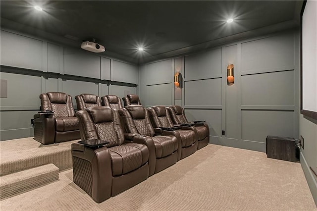 carpeted cinema featuring recessed lighting and a decorative wall