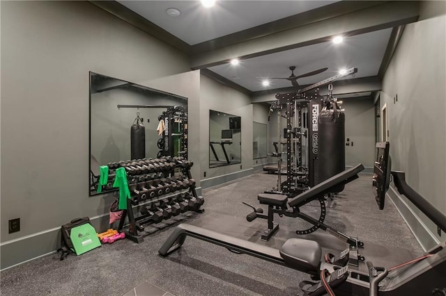 workout area with a ceiling fan, baseboards, and crown molding