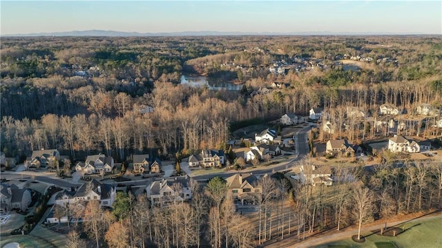 aerial view with a residential view and a view of trees