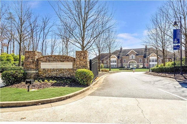 exterior space featuring a residential view and fence