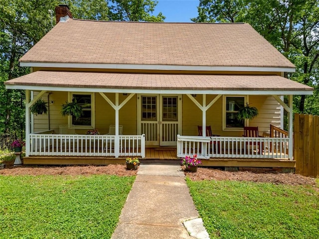 500 Nolan Rd, Carrollton, GA 30116 - farmhouse inspired home featuring a porch, a chimney, and roof with shingles