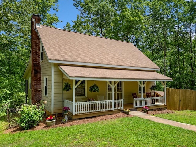 500 Nolan Rd, Carrollton, GA 30116 - view of front of home with a porch, a chimney, and roof with shingles