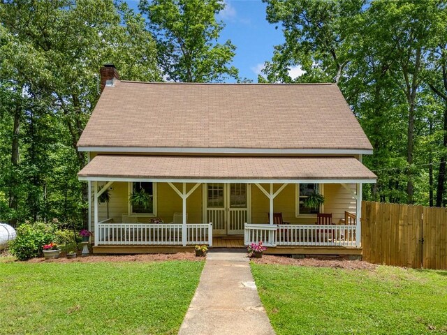 500 Nolan Rd, Carrollton, GA 30116 - view of front facade featuring a porch, a chimney, and a shingled roof
