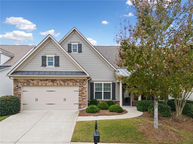 view of front of property with a front lawn and a garage