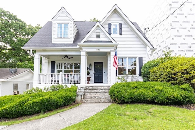 view of front of house featuring covered porch, a front yard, and ceiling fan