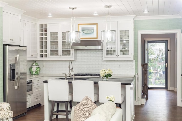 kitchen featuring stainless steel appliances, glass insert cabinets, dark wood finished floors, white cabinets, and crown molding