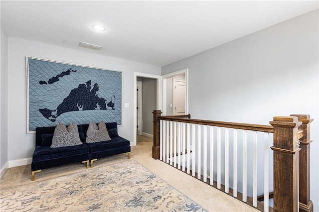 hallway with carpet, baseboards, recessed lighting, and an upstairs landing