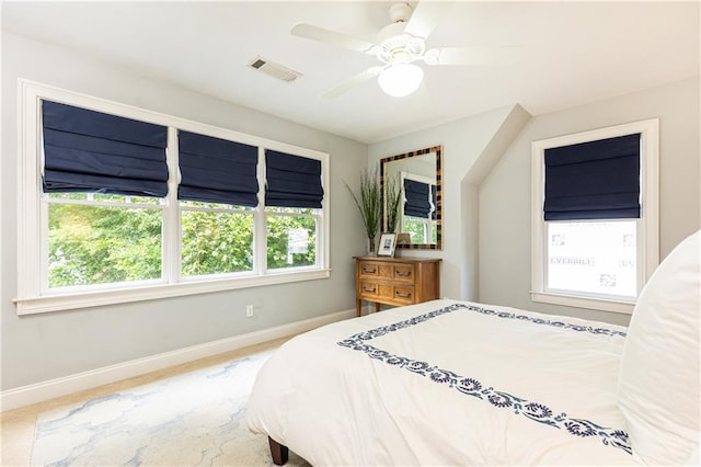bedroom with baseboards, multiple windows, and ceiling fan