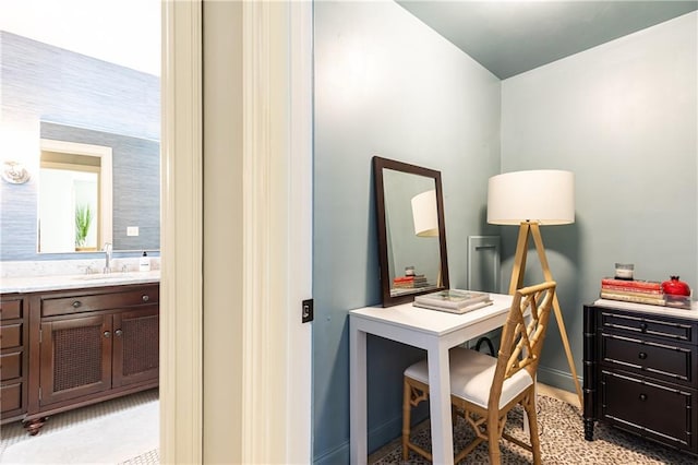 office featuring a sink and baseboards