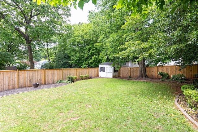 view of yard featuring a storage shed and an outdoor structure