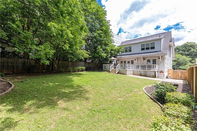 view of yard with a wooden deck