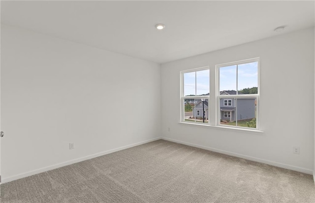 386 Rock View Ln, Covington, GA 30016 - carpeted empty room with baseboards, a smoke detector, and recessed lighting