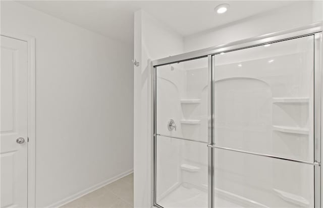 386 Rock View Ln, Covington, GA 30016 - bathroom featuring a stall shower, recessed lighting, and baseboards