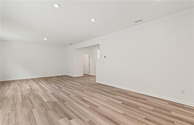 spare room featuring light hardwood / wood-style floors