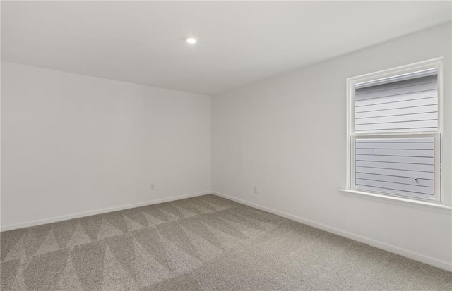 386 Rock View Ln, Covington, GA 30016 - carpeted spare room with baseboards and recessed lighting