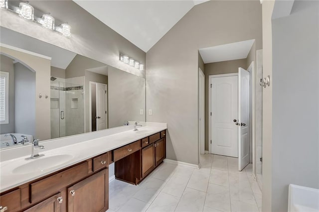 bathroom featuring vanity, vaulted ceiling, and separate shower and tub