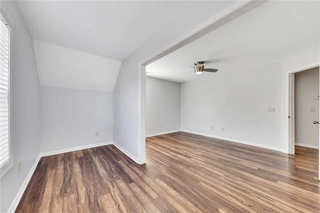 additional living space with dark wood-type flooring, ceiling fan, and lofted ceiling