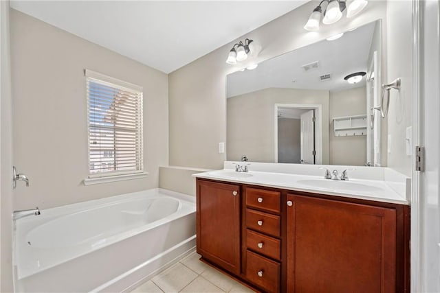 bathroom featuring tile patterned flooring, vanity, and a bathtub