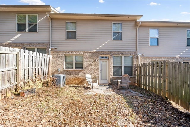 back of property featuring cooling unit