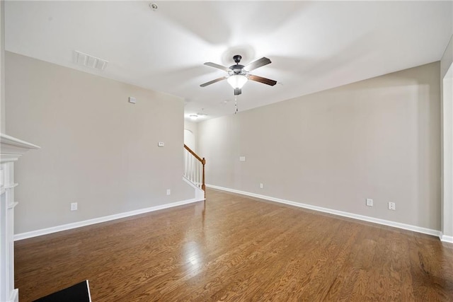 spare room featuring hardwood / wood-style flooring and ceiling fan