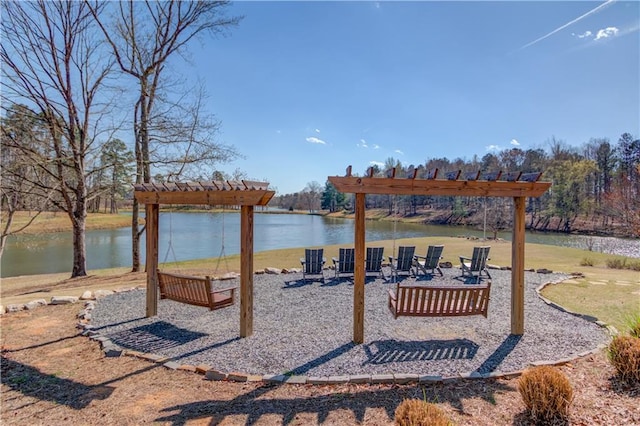 exterior space featuring a pergola and a water view