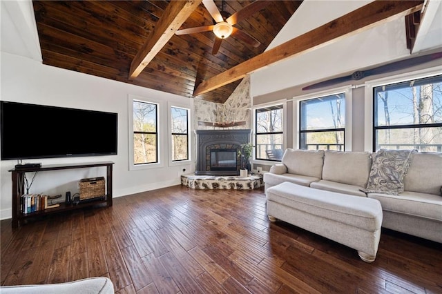 living area featuring hardwood / wood-style flooring, wooden ceiling, a healthy amount of sunlight, and beamed ceiling