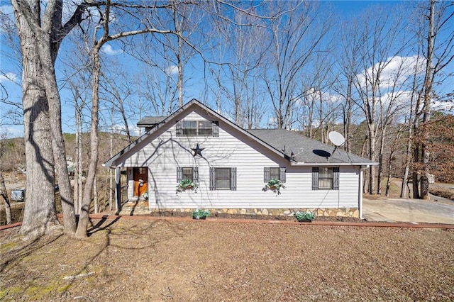 view of front of home featuring a shingled roof