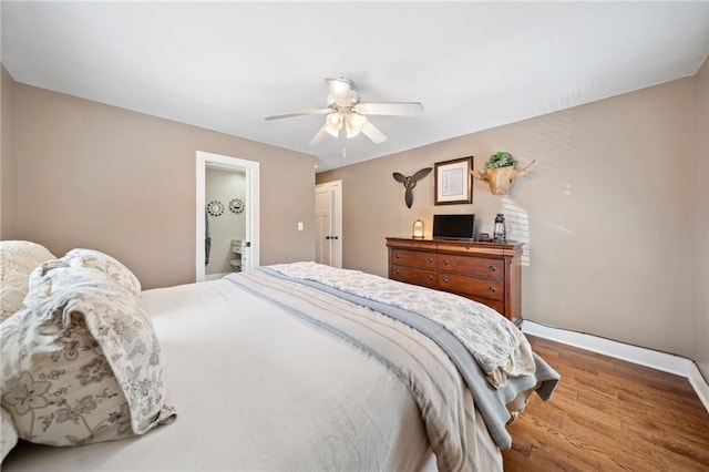 bedroom with wood finished floors, baseboards, and ceiling fan