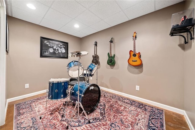 playroom featuring recessed lighting, a drop ceiling, and baseboards