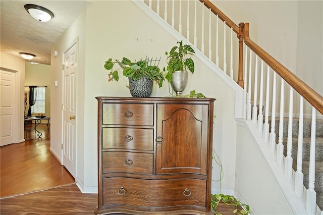 corridor featuring hardwood / wood-style flooring