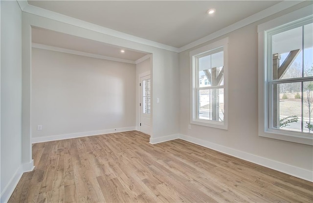 unfurnished room with baseboards, light wood finished floors, recessed lighting, and crown molding